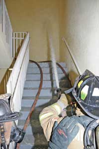 (13) The nozzle is flowed before opening the stairwell door to the fire floor. 
